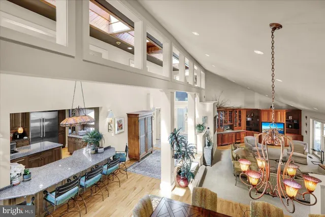 a bedroom with a large bed and a large window