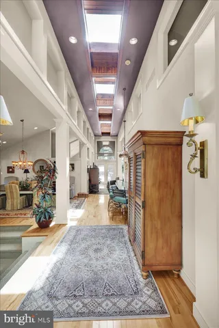 a view of an empty room with large windows