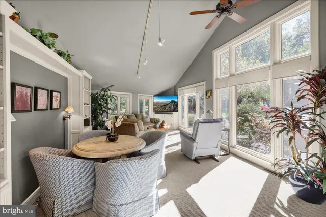 a kitchen with stainless steel appliances white cabinets and a stove top oven