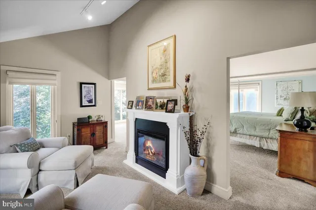 a kitchen with white cabinets and refrigerator