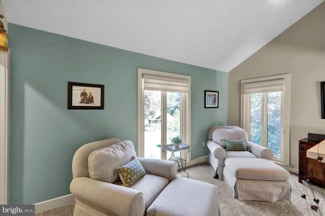 a bathroom with a toilet a sink and a mirror