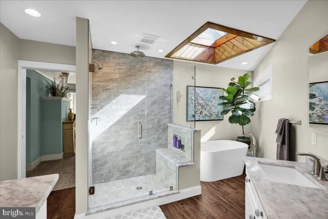 an aerial view of a house with a yard and garden