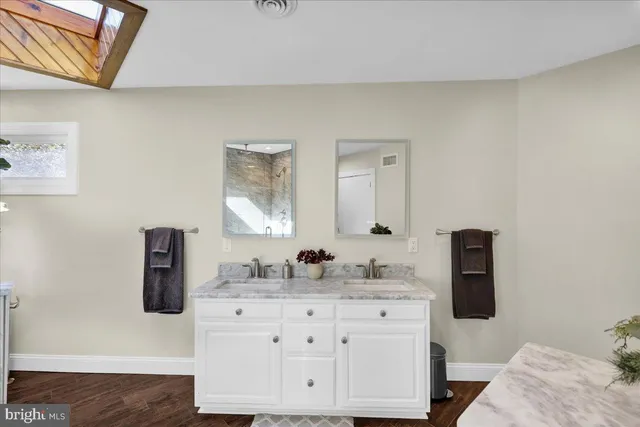 an aerial view of a house with a yard and outdoor seating