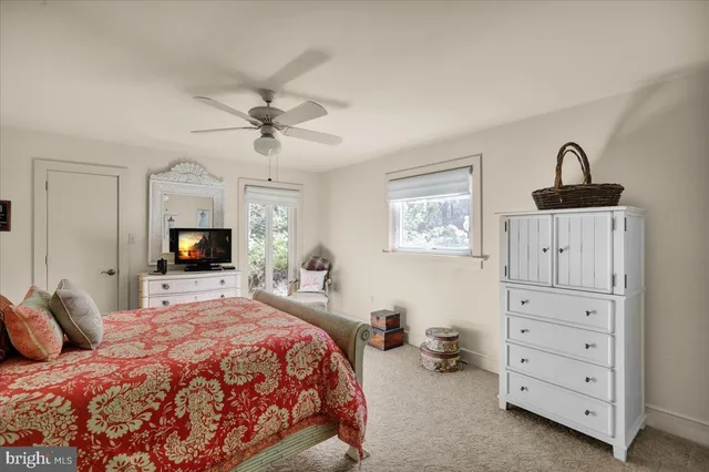 a view of a chairs and table in th patio