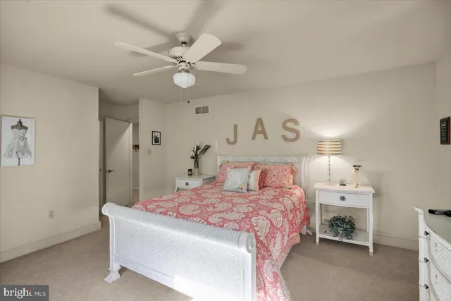 an aerial view of a house with a yard and lake view