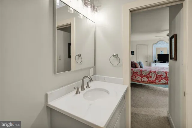 a wooden bench sitting in the middle of a yard