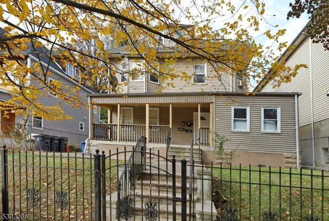 front view of a brick house with a large windows