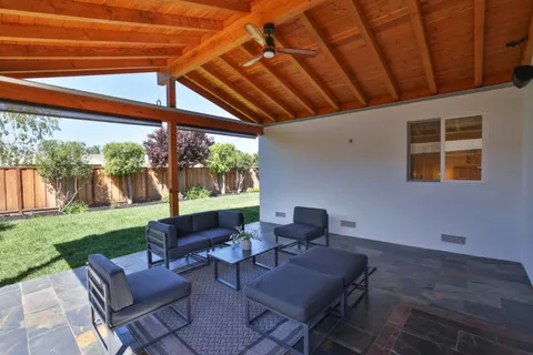 a outdoor living space with furniture and garden view
