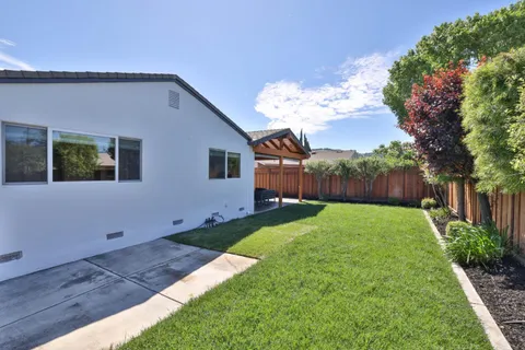 a backyard of a house with lots of green space