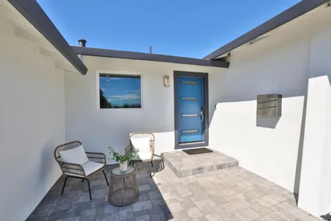 a living room with furniture and a table