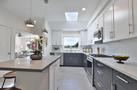 a kitchen with a sink and cabinets