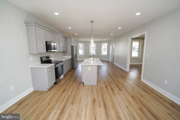 a utility room with sink dryer and washer