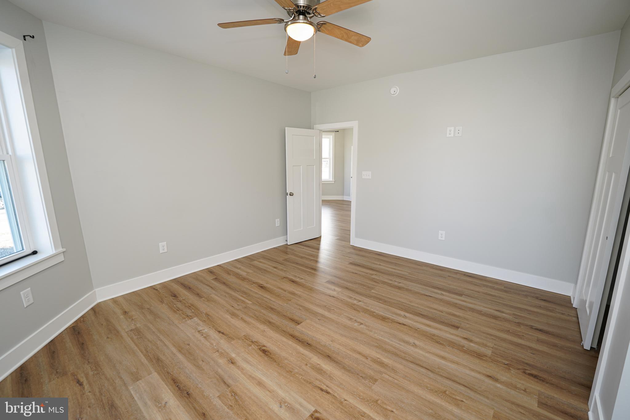 111 East Jewell Street Delmar, DE 19940 - Photo 23 of 59 wooden floor in an empty room with a window