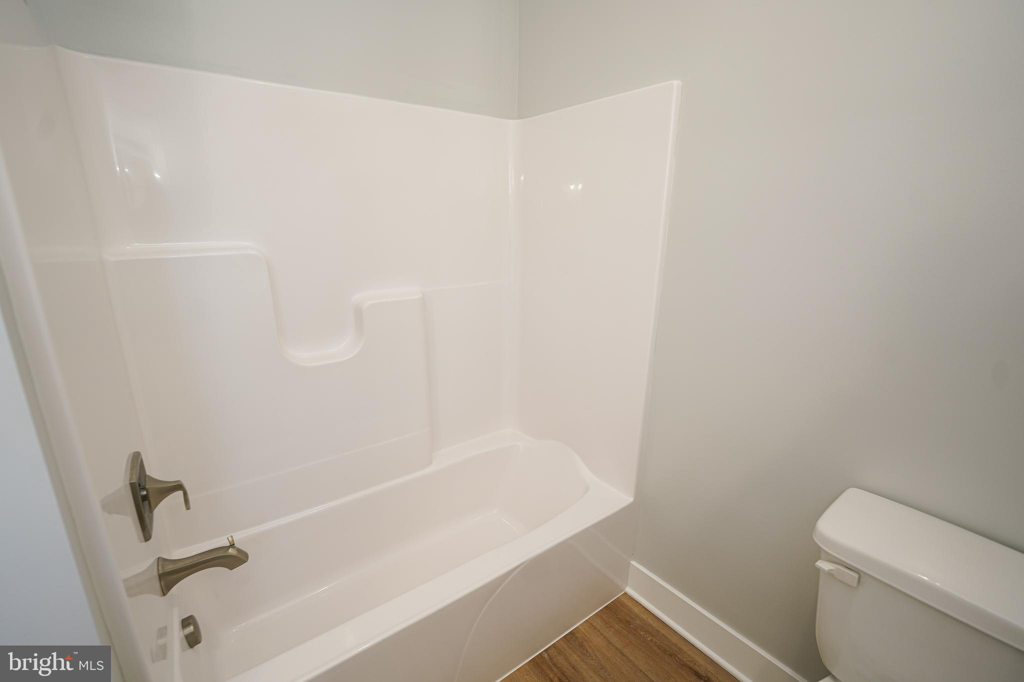 111 East Jewell Street Delmar, DE 19940 - Photo 27 of 59 a bathroom with a bathtub and toilet