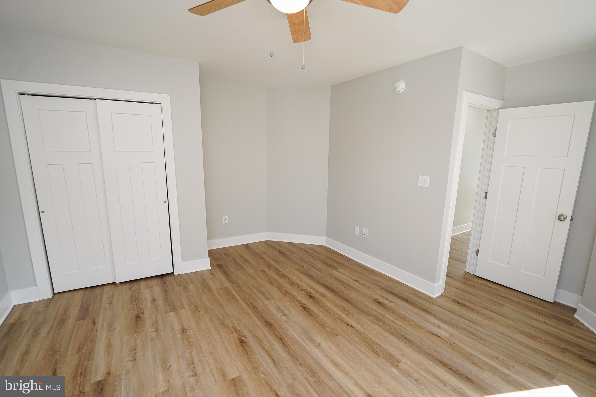 111 East Jewell Street Delmar, DE 19940 - Photo 35 of 59 wooden floor in an empty room with a window