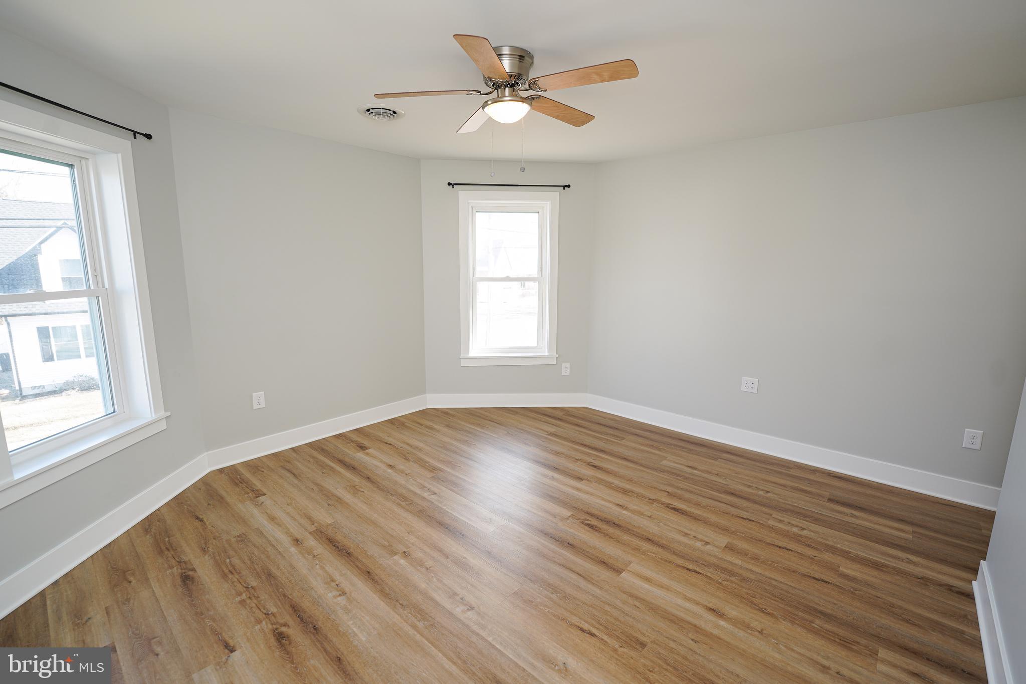 111 East Jewell Street Delmar, DE 19940 - Photo 44 of 59 wooden floor in an empty room with a window