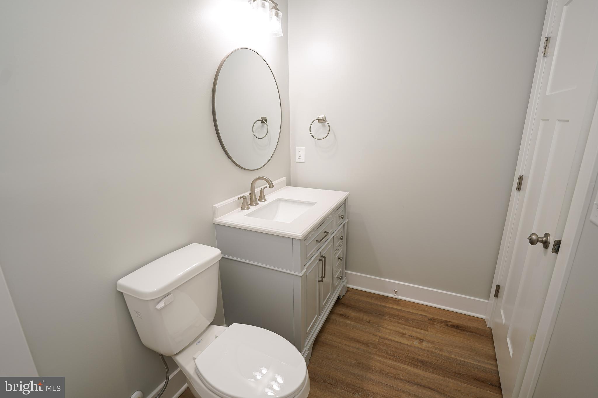 111 East Jewell Street Delmar, DE 19940 - Photo 48 of 59 a bathroom with a sink toilet and a mirror