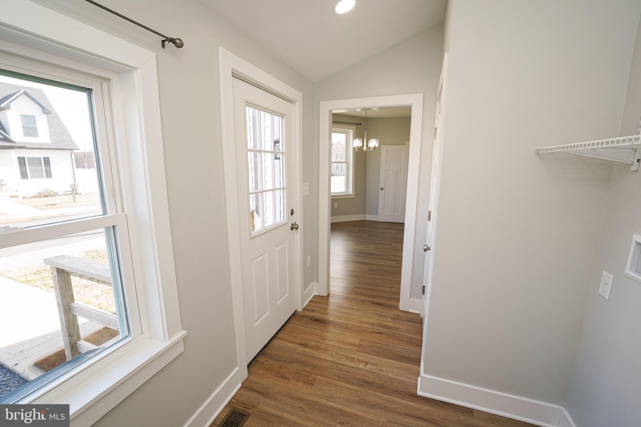 111 East Jewell Street Delmar, DE 19940 - Photo 54 of 59 a view of a hallway with wooden floor and a bathroom