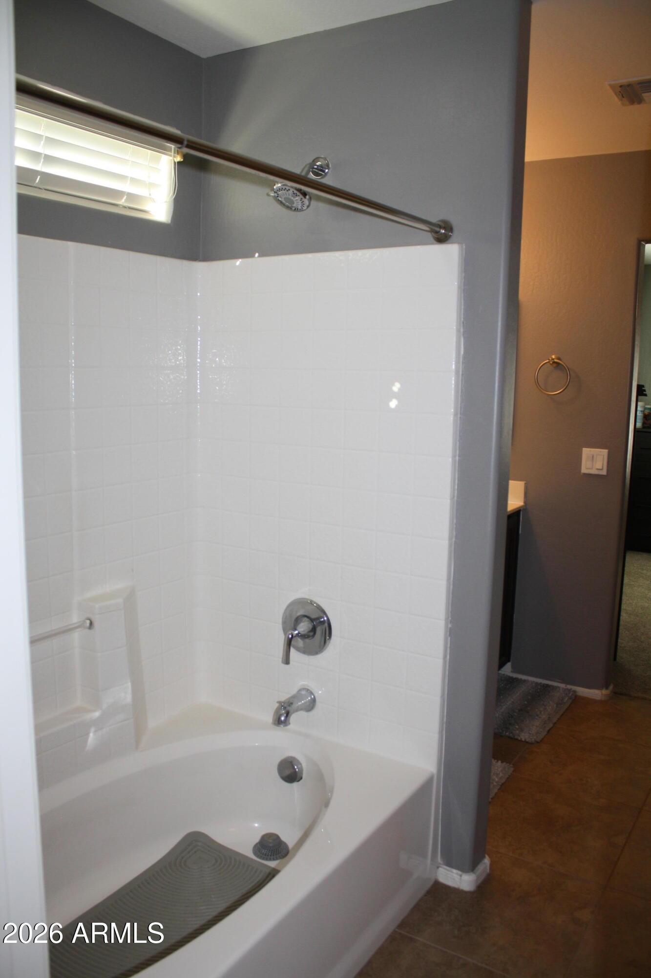 10225 West Camelback Road, Unit 19 Phoenix, AZ 85037 - Photo 36 of 51 a bathroom with a bathtub and a shower