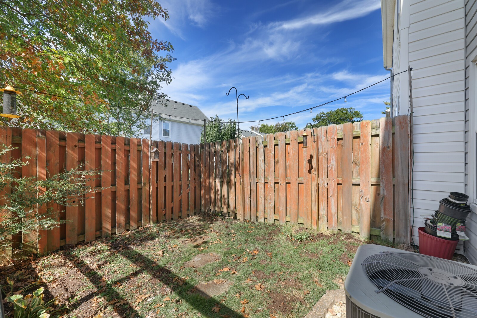 3405 Old Anderson Road, Unit 231 Antioch, TN 37013 - Photo 17 of 18 a backyard of a house with lawn chairs and wooden fence