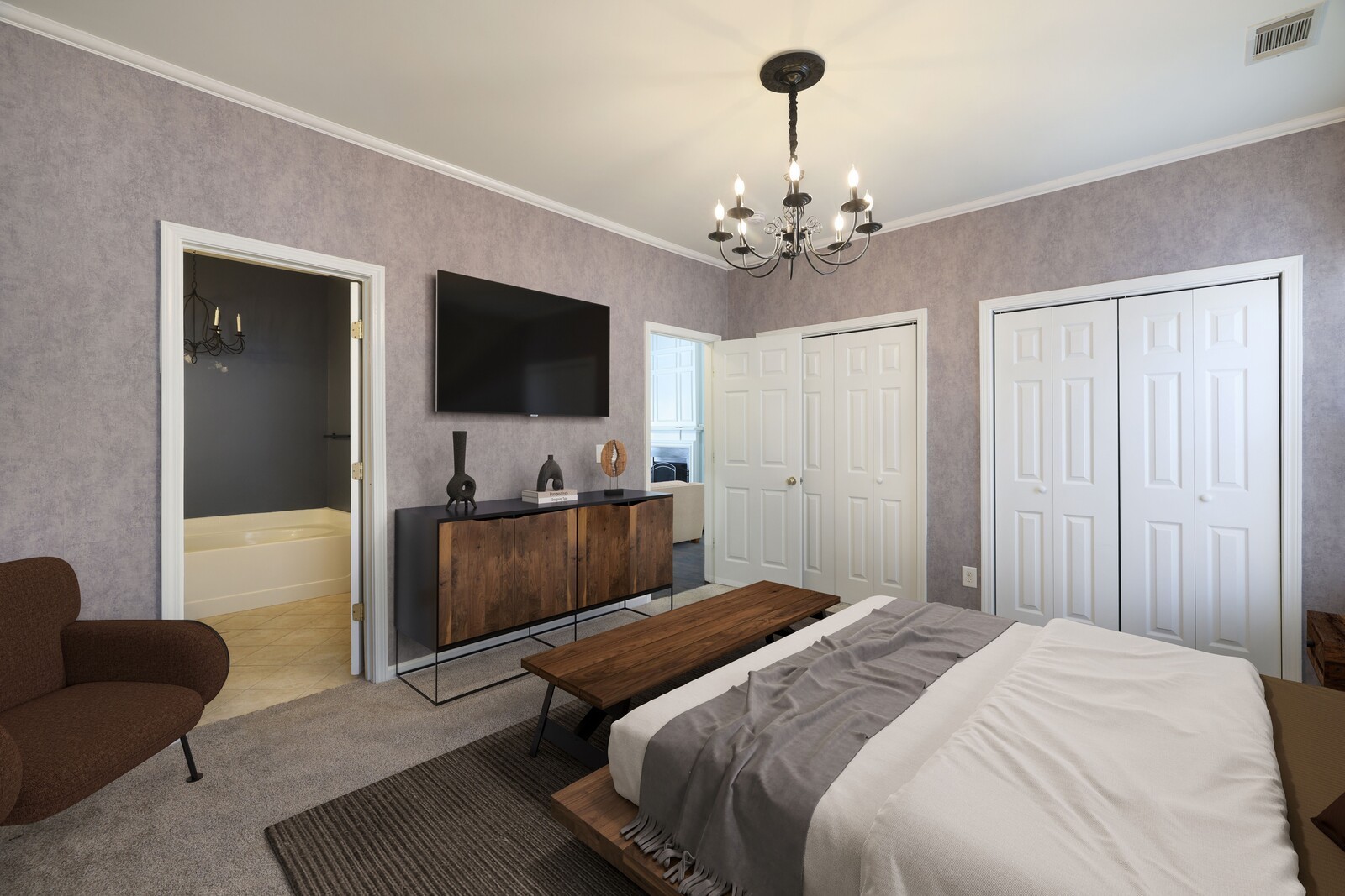 3405 Old Anderson Road, Unit 231 Antioch, TN 37013 - Photo 9 of 18 a bedroom with a bed and a flat screen tv