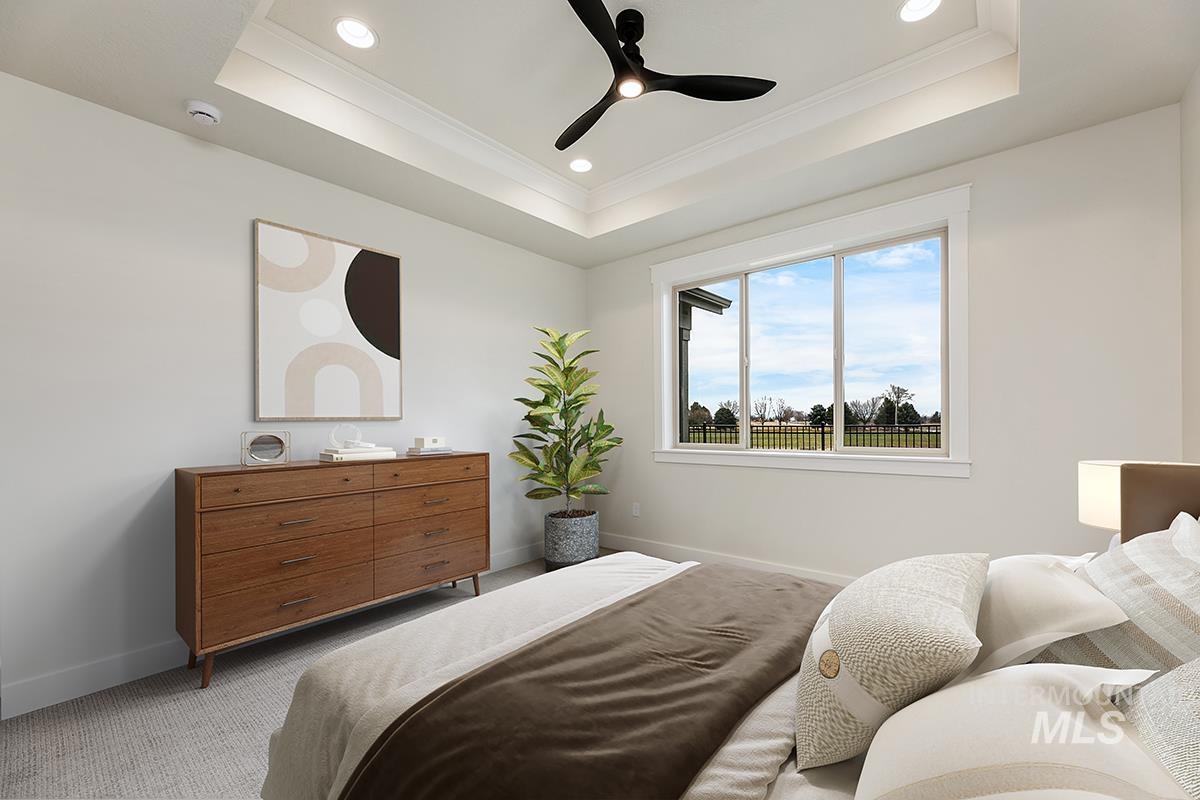 3281 East Englehart Lane Meridian, ID 83642 - Photo 10 of 35 Bedroom featuring carpet flooring, ornamental molding, ceiling fan, recessed lighting, and a tray ceiling