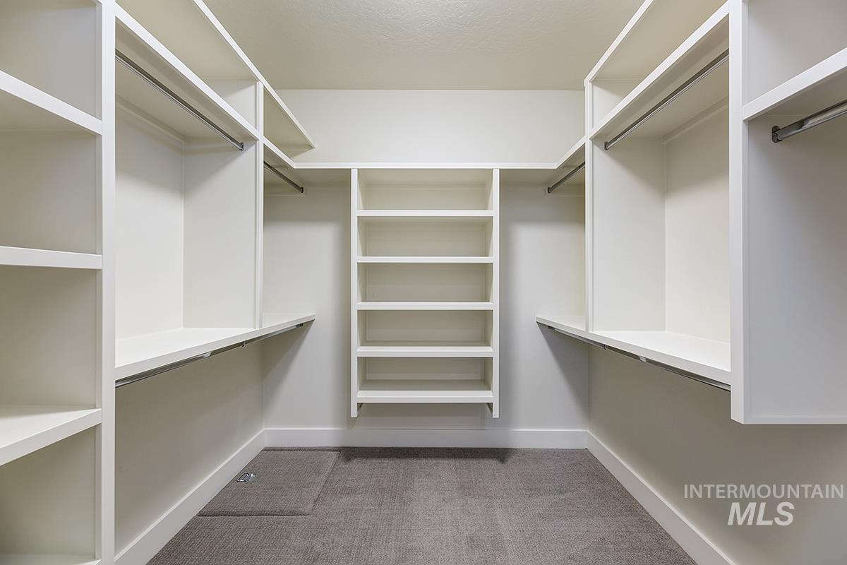 3281 East Englehart Lane Meridian, ID 83642 - Photo 13 of 35 Walk in closet featuring light carpet