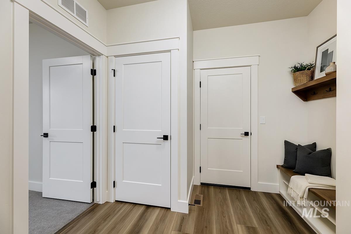 3281 East Englehart Lane Meridian, ID 83642 - Photo 18 of 35 Mudroom featuring wood finished floors and baseboards