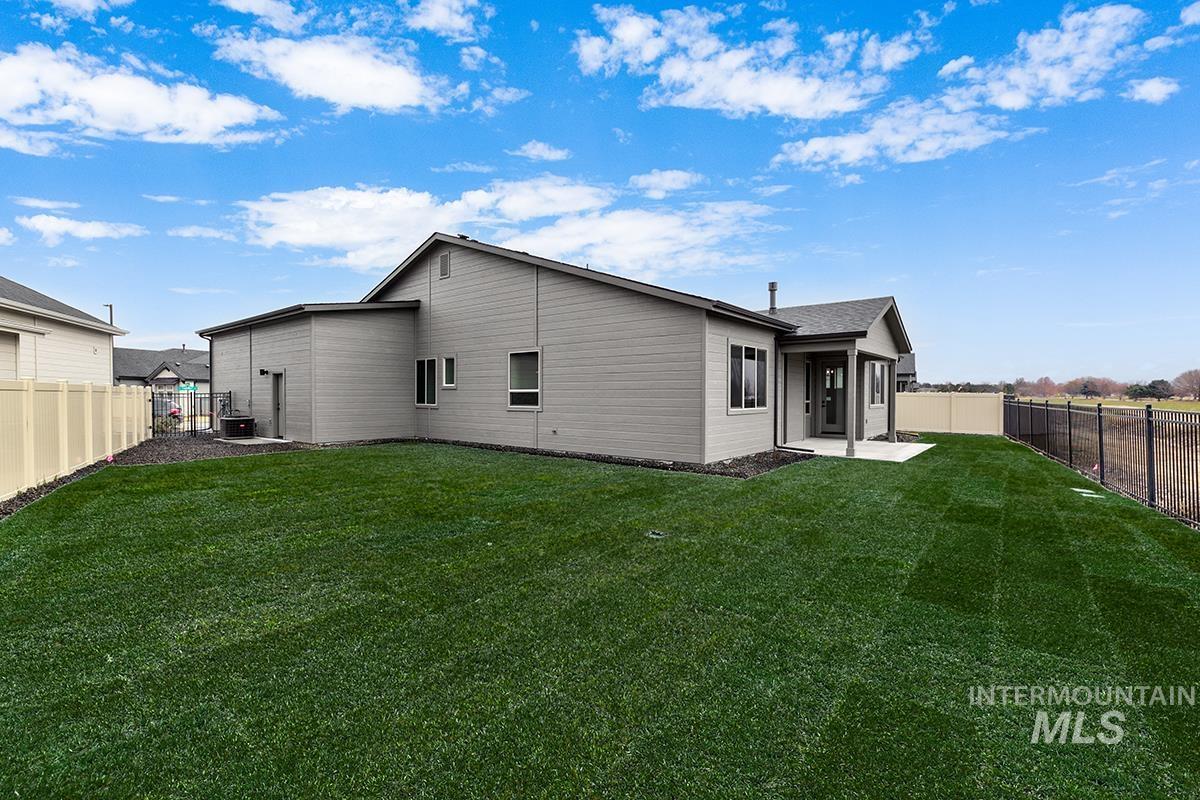 3281 East Englehart Lane Meridian, ID 83642 - Photo 20 of 35 Rear view of house featuring a fenced backyard and a patio area