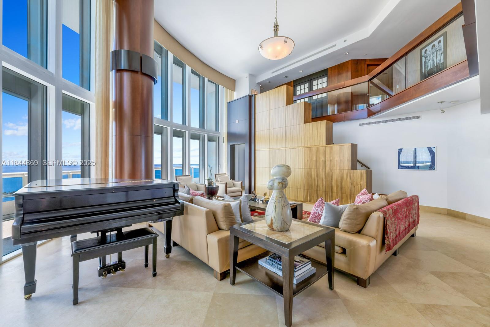 1643 Brickell Avenue, Unit 3702 Miami, FL 33129 - Photo 4 of 32 a living room with furniture and a piano