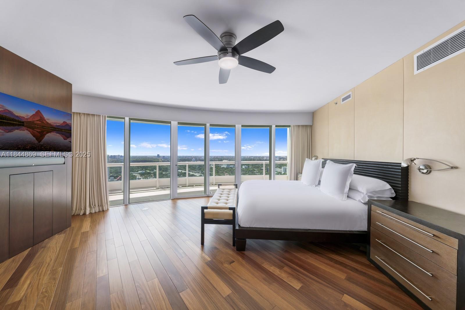 1643 Brickell Avenue, Unit 3702 Miami, FL 33129 - Photo 10 of 32 a bedroom with a bed and a large window