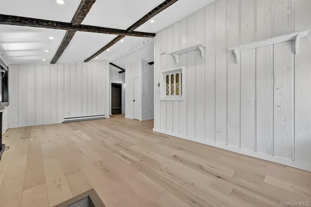 a view of a room with wooden walls