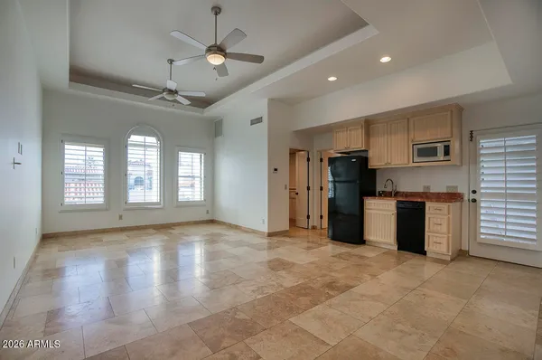 a view of kitchen with stainless steel appliances granite countertop a stove cabinets and wooden floor