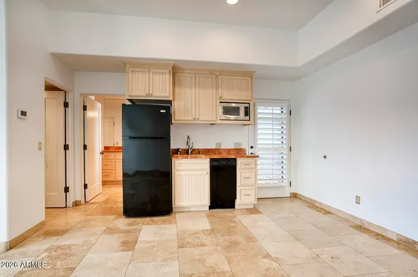 a kitchen with a refrigerator and a oven