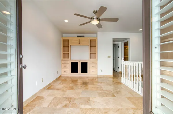 a view of a hallway with a livingroom