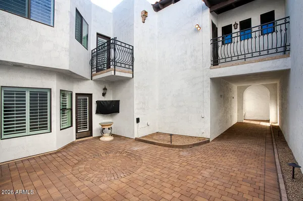 a view of a livingroom with furniture and staircase