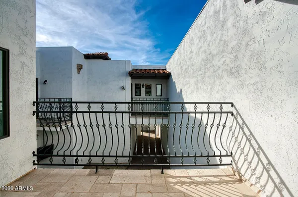 a view of balcony with wooden floor