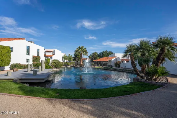 a view of swimming pool with outdoor seating