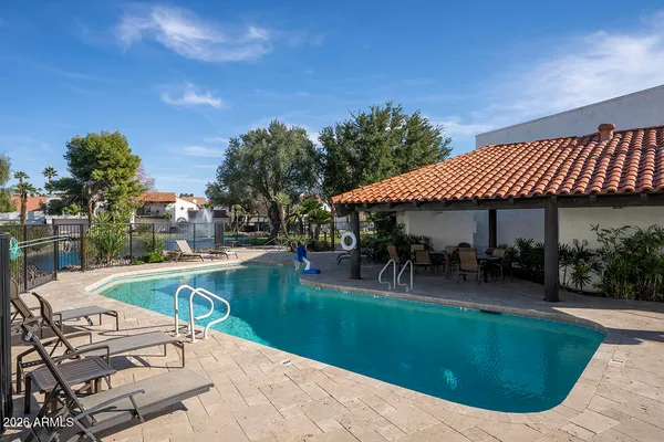 a view of a house with a yard porch and sitting area
