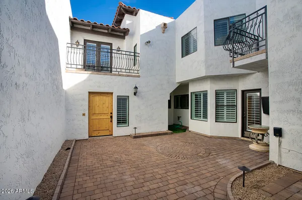 a view of a house with large windows