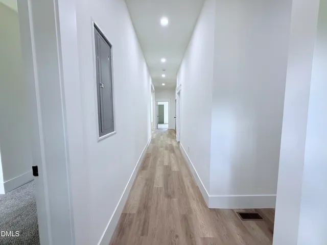 a bedroom with a bed and potted plant