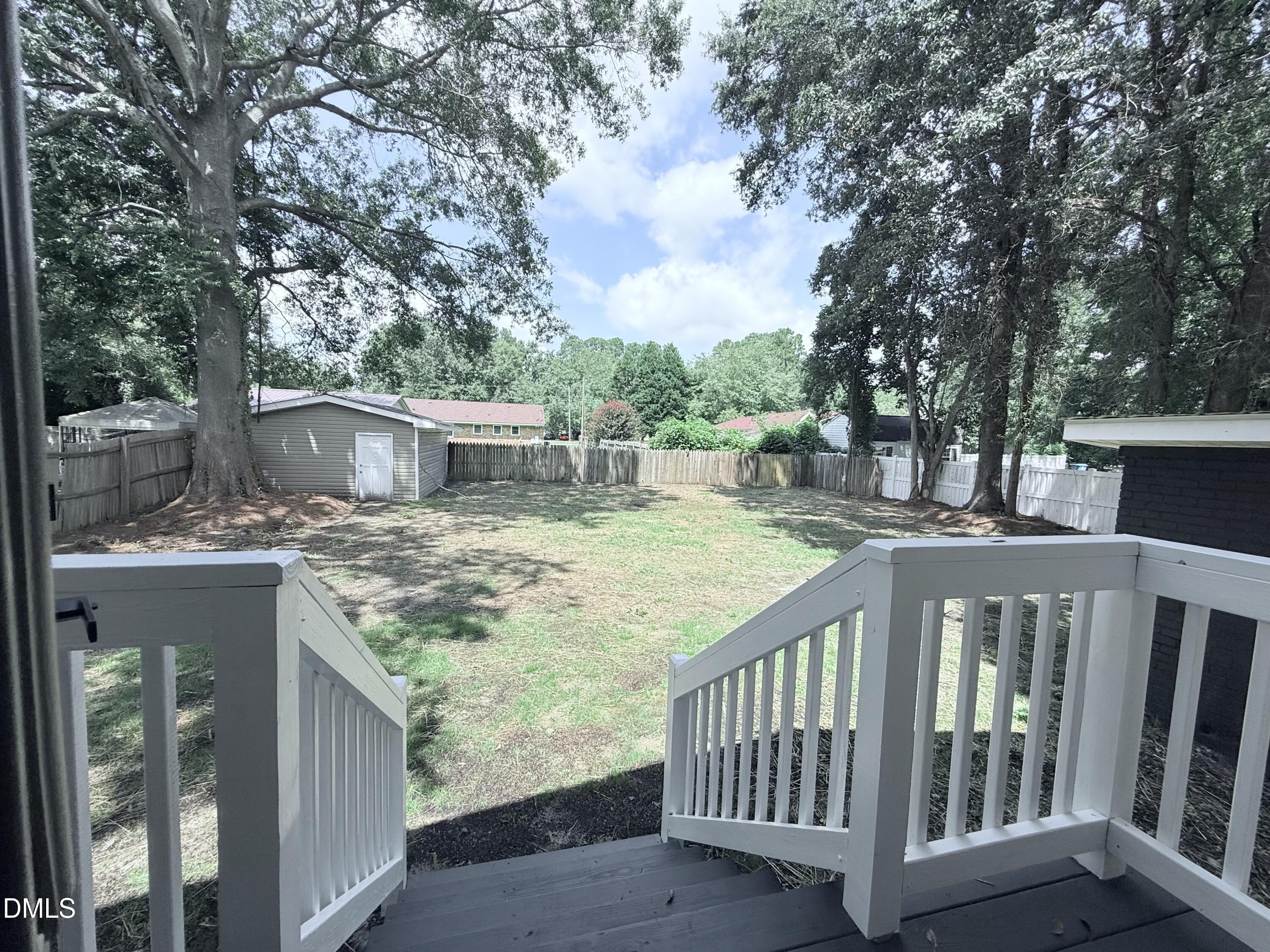 604 South Layton Avenue Dunn, NC 28334 - Photo 26 of 26 a view of house with backyard and deck