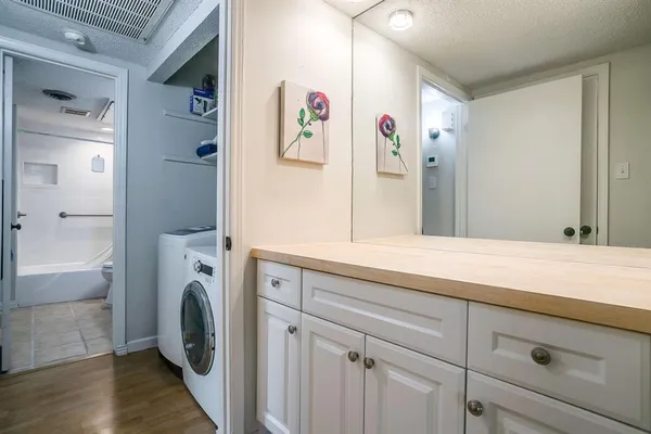 a bedroom with a bed and lamp with window