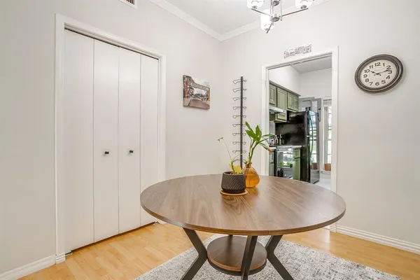 a dining room with furniture and window