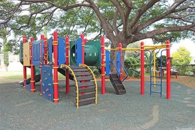 a view of swings and white garage