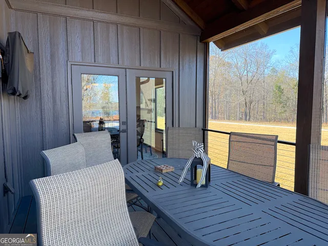 a kitchen with a sink cabinets and wooden floor