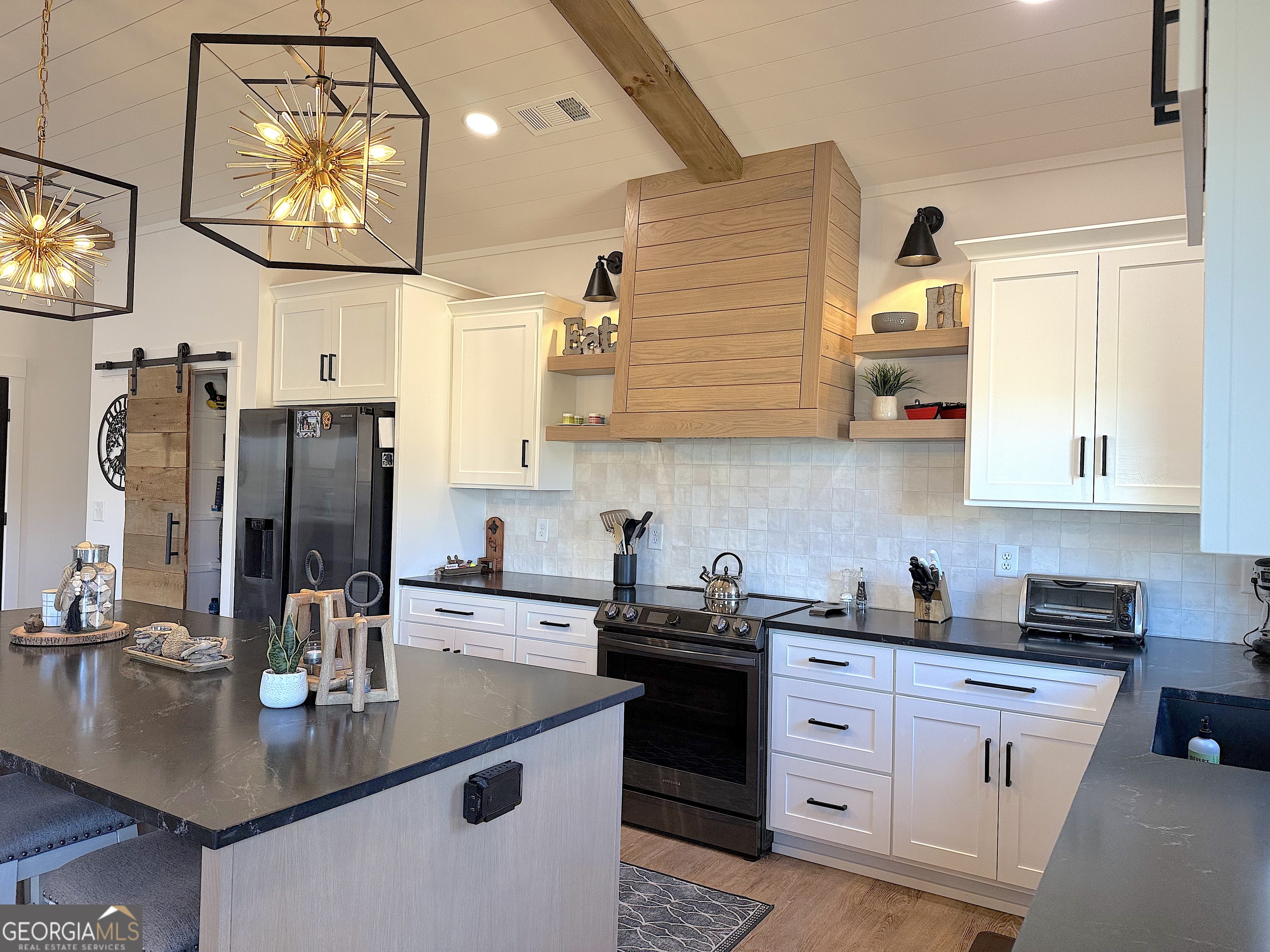73 Yacht Club Hartwell, GA 30643 - Photo 16 of 71 a kitchen with stainless steel appliances granite countertop a sink a stove and cabinets