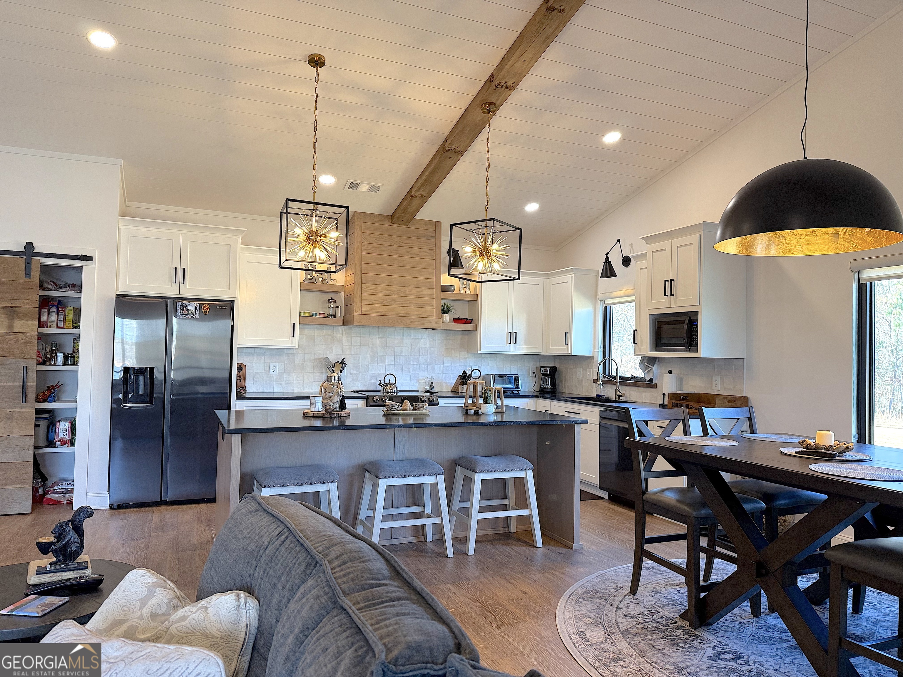 73 Yacht Club Hartwell, GA 30643 - Photo 19 of 71 a kitchen with stainless steel appliances granite countertop a stove a refrigerator a kitchen island a dining table and chairs