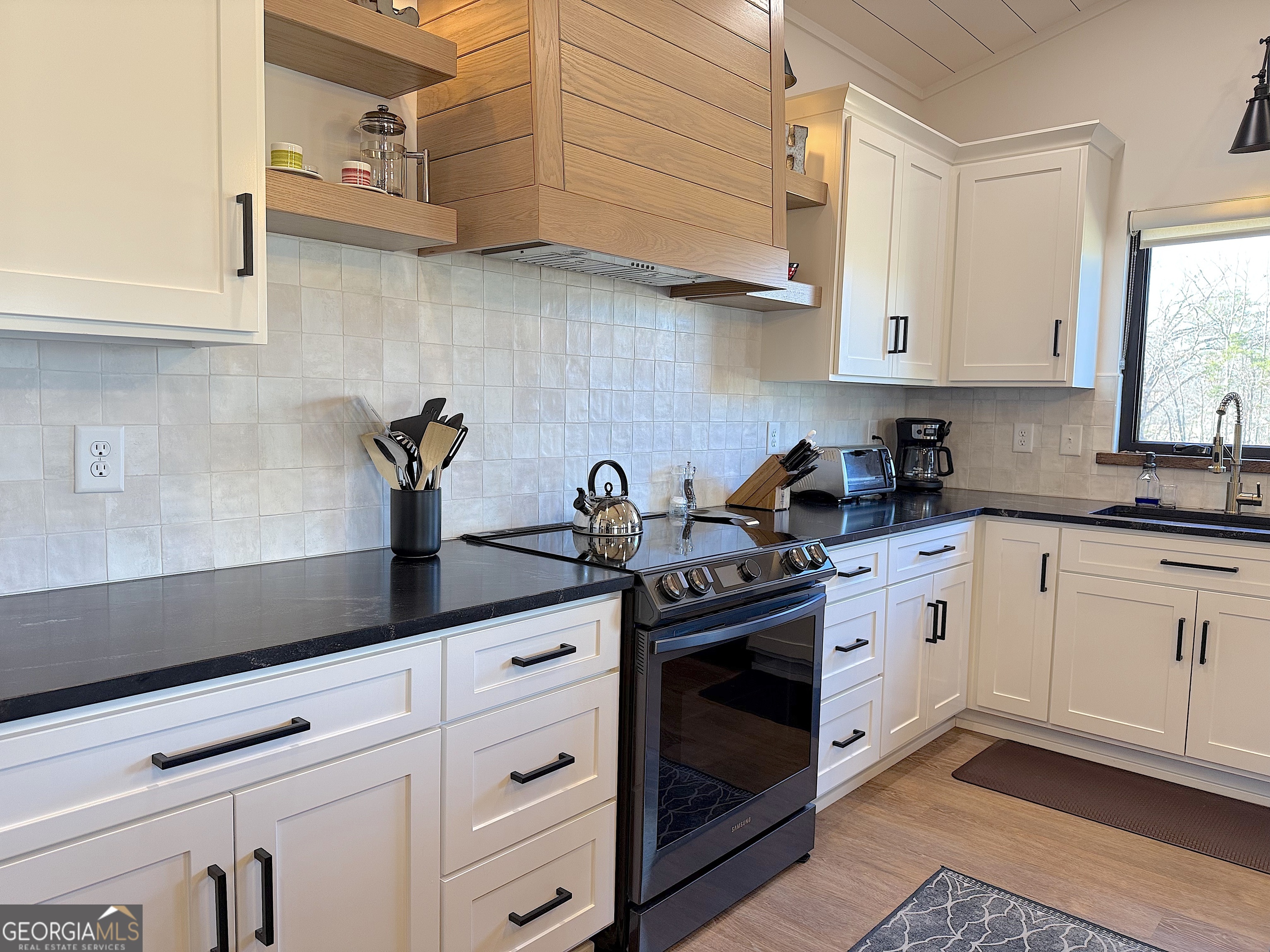 73 Yacht Club Hartwell, GA 30643 - Photo 20 of 71 a kitchen with stainless steel appliances granite countertop a sink a stove and cabinets