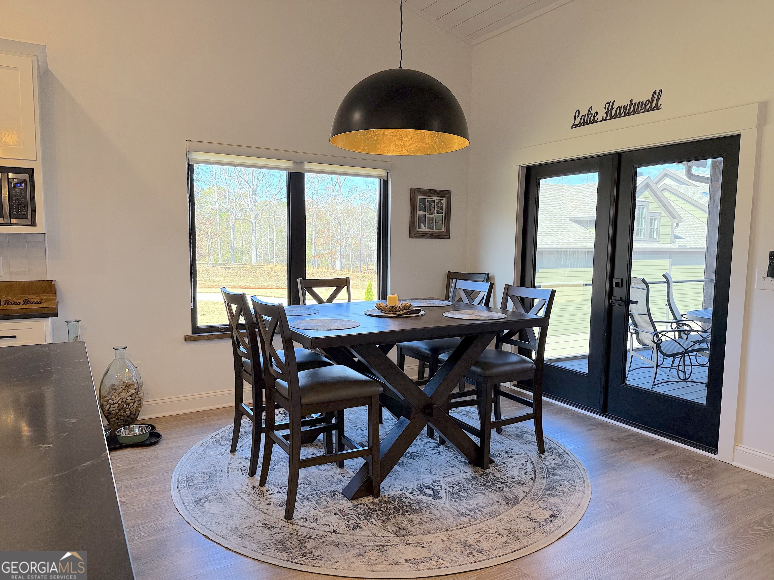73 Yacht Club Hartwell, GA 30643 - Photo 25 of 71 a view of a dining room with furniture window and wooden floor